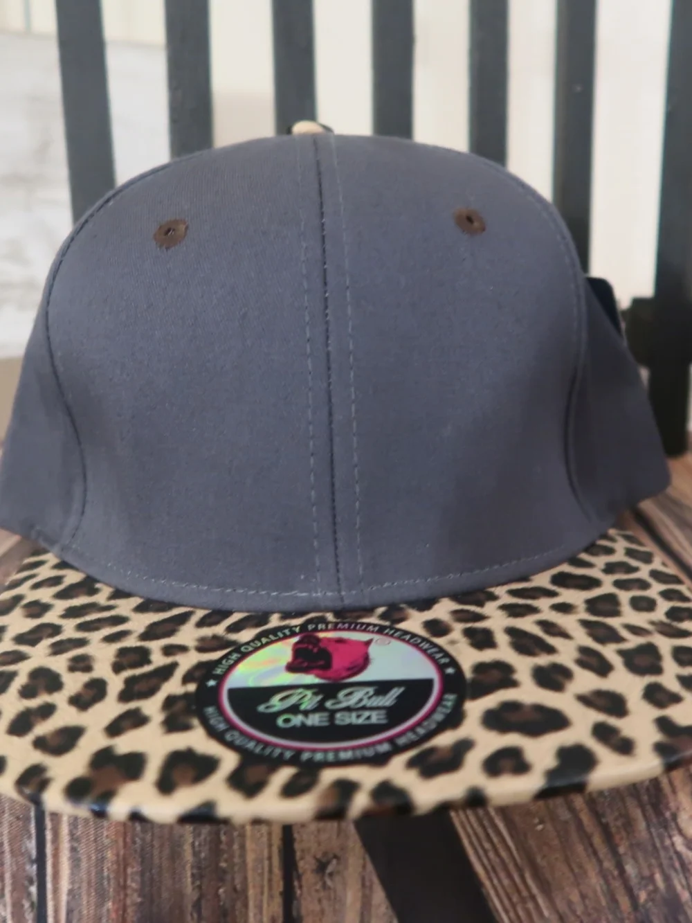 One Size Black Snapback Cap with Leopard Brim